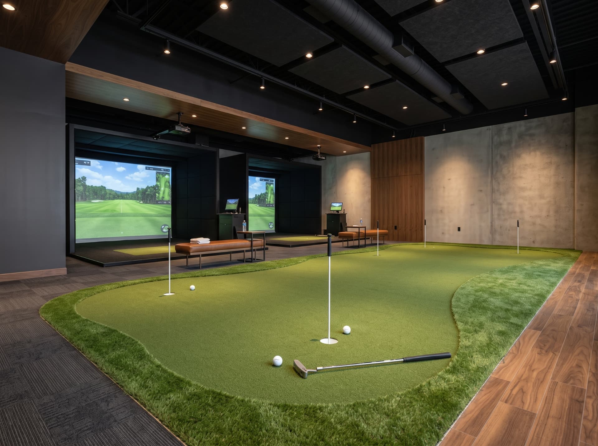 Indoor putting green beside golf simulator bays at a virtual golf centre