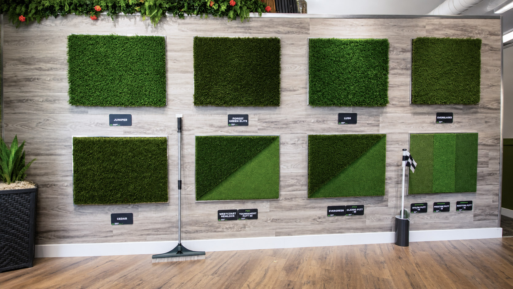 Premium Grass Blades showroom with labelled artificial turf samples on display